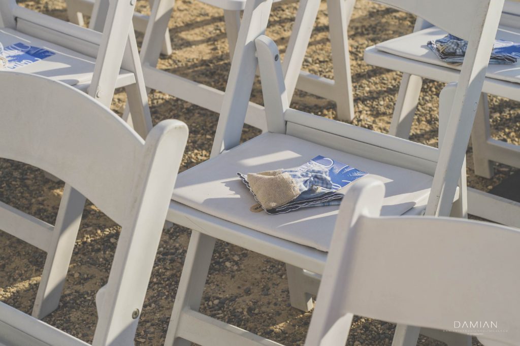 Guest chairs at the beach for ceremony